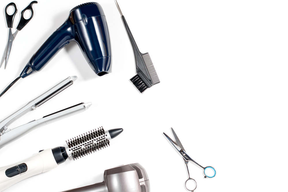 Various,hair,styling,devices,on,white,background,,top,view